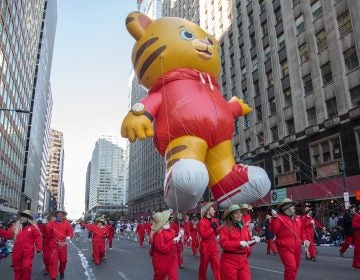 Daniel Tiger floats down Market Street during the 98th annual Philadelphia Thanksgiving Day parade, November 23, 2017. (Emily Cohen for WHYY)