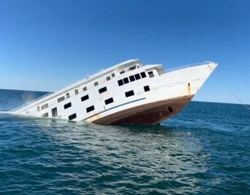 The 215-foot-long cruise ship American Glory slips below the surface of the Atlantic Ocean off the Delaware coast on Monday. The ship will join hundreds of subway cars and other items to become part of the Redbird Inshore Artificial Reef. (Courtesy Chris Ragni)