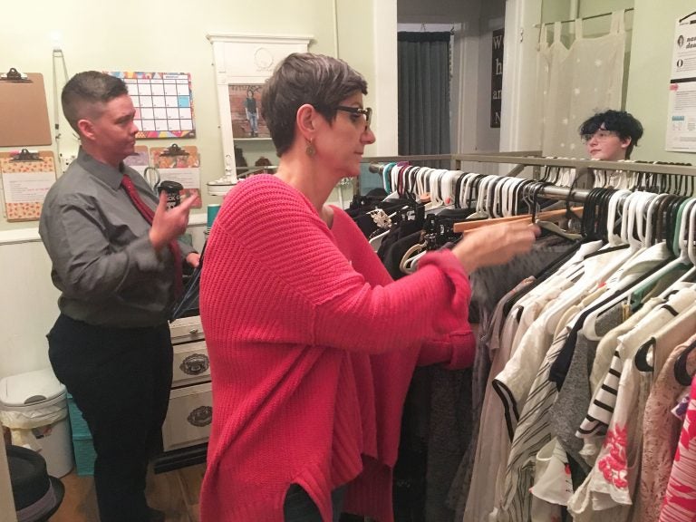 Tristan Vaught (left) and Nancy Dawson are the co-founders of clothing exchange Transform. A 17-year-old client Elliot Reed (far right) was the first customer when the space opened. (Ann Thompson/WVXU)