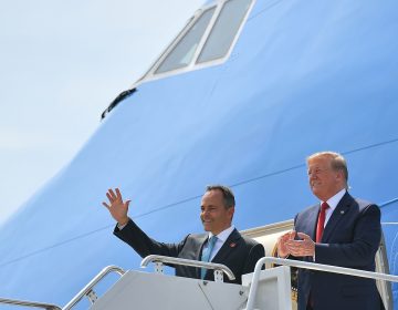 President Trump has been campaigning for Kentucky Republican Gov. Matt Bevin (left), who is on the ballot for reelection Tuesday. Above, they step off Air Force One in August at Louisville, Ky.'s airport. (Mandel Ngan/AFP/Getty Images)