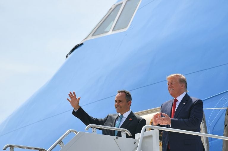 President Trump has been campaigning for Kentucky Republican Gov. Matt Bevin (left), who is on the ballot for reelection Tuesday. Above, they step off Air Force One in August at Louisville, Ky.'s airport. (Mandel Ngan/AFP/Getty Images)