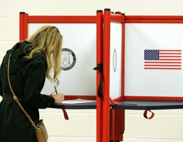 A voter casting a ballot in Louisville, Ky. this month. Long-serving election officials around the country are retiring ahead of the 2020 election, which could be among the most challenging to administer in the country's history. (John Sommers II/Getty Images)