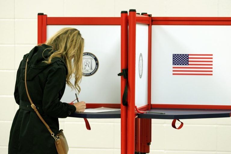 A voter casting a ballot in Louisville, Ky. this month. Long-serving election officials around the country are retiring ahead of the 2020 election, which could be among the most challenging to administer in the country's history. (John Sommers II/Getty Images)