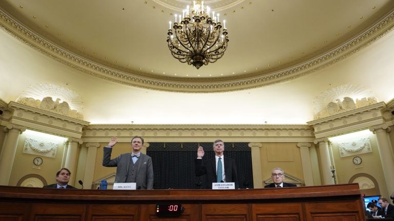 Deputy Assistant Secretary for European and Eurasian Affairs George Kent and top U.S. diplomat in Ukraine William Taylor are sworn in prior to testifying before the House Intelligence Committee on Wednesday. (Pool/Getty Images)