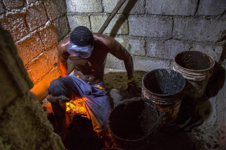 Gabriel Toto is a 'bayakou' or latrine cleaner, in Haiti. (Marie Arago for NPR)