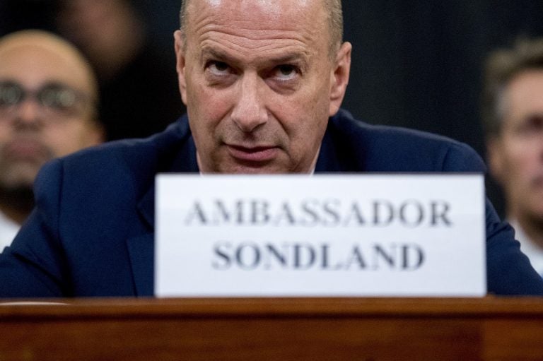 Ambassador Gordon Sondland, U.S. Ambassador to the European Union, center, appears before the House Intelligence Committee on Capitol Hill in Washington, Wednesday, Nov. 20, 2019, during a public impeachment hearing of President Donald Trump's efforts to tie U.S. aid for Ukraine to investigations of his political opponents. (AP Photo/Andrew Harnik)
