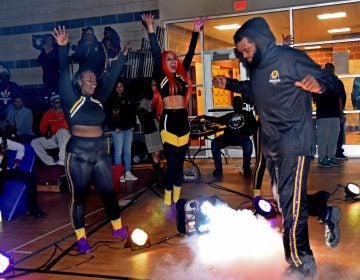 Before the start of a November 10 game against the Jersey Express, Camden Monarch Lenny Cooke makes an entrance. (April Saul for WHYY)