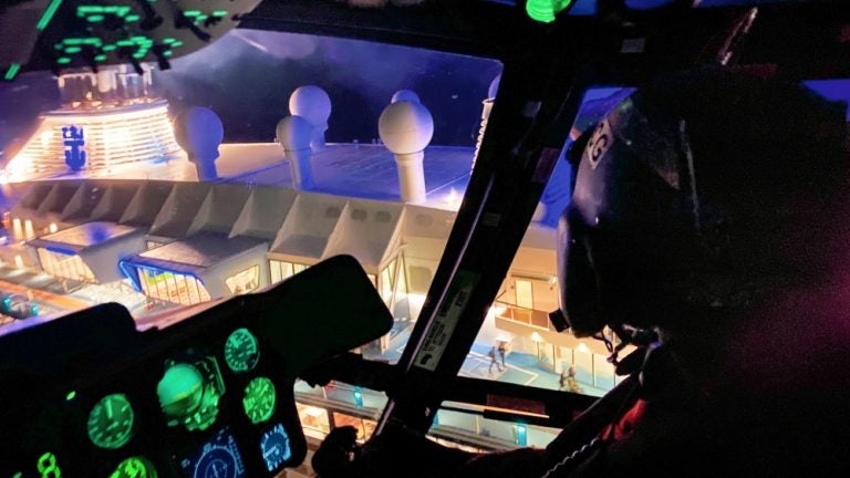 A Coast Guard on approach to a cruise ship off New Jersey Saturday night. (U.S. Coast Guard photo by Lt. Joshua Mitcheltree)