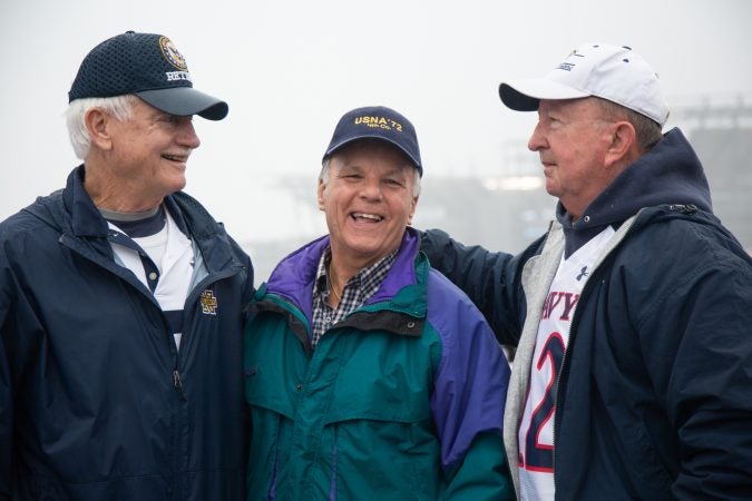 Don Carlson, Jerry Stahl, and Mike Brennan (left to right) graduated from the Naval academy in 1972. They've been coming to the annual Army-Navy game together since they were cadets. Today they traveled from Maryland, South Carolina, and Washington DC to watch the game together in Philadelphia, Pa on December 14th 2019. (Emily Cohen for WHYY)