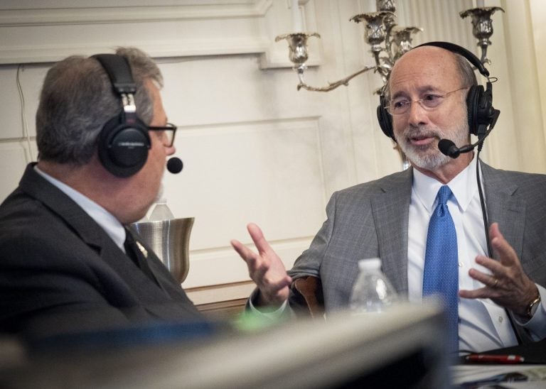 Pennsylvania Gov. Tom Wolf, right, speaks with Scott LaMar, host of WITF's Smart Talk, during a live broadcast at the Governor's Residence in Harrisburg on Dec. 11, 2019. (Joanne Cassaro/WITF)