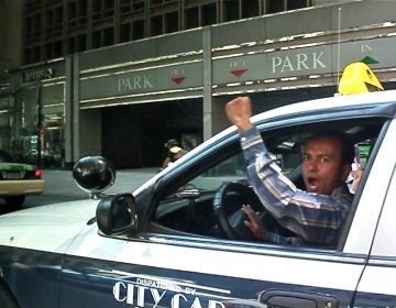 Taxi drivers honk their horns and chant 'PPA Mafia' as they drive slowly down Market Street toward City Hall during a protest against fee hikes in 2012. A video of the protest is part of the People's Media Record, an online archive set up by the Media Mobilizing Project. (Still from video)