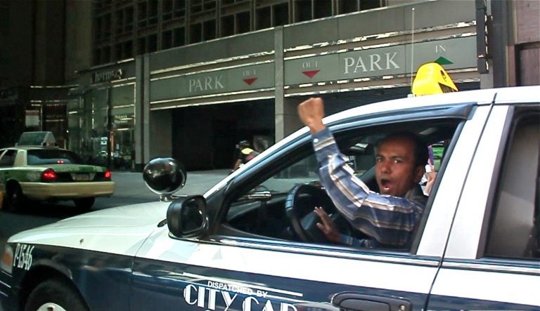 Taxi drivers honk their horns and chant 'PPA Mafia' as they drive slowly down Market Street toward City Hall during a protest against fee hikes in 2012. A video of the protest is part of the People's Media Record, an online archive set up by the Media Mobilizing Project. (Still from video)