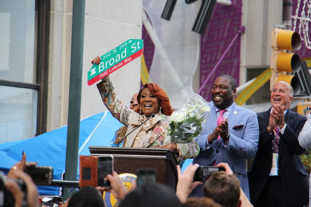 Patti Labelle waves a sign renaming part of Broad St. in her honor.