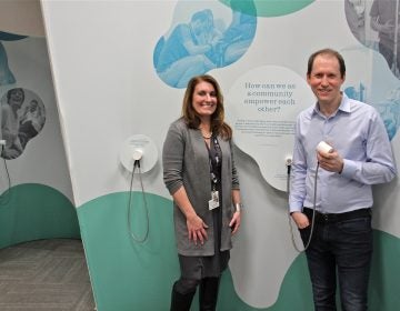 Stephanie Kindt (left) and Aaron Levy are the curators of Listening Lab, a year-long traveling exhibit that tells the stories of doctors and patients and explores the ways in which listening can improve care. (Emma Lee/WHYY)