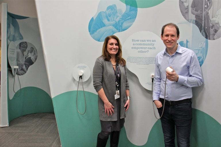 Stephanie Kindt (left) and Aaron Levy are the curators of Listening Lab, a year-long traveling exhibit that tells the stories of doctors and patients and explores the ways in which listening can improve care. (Emma Lee/WHYY)