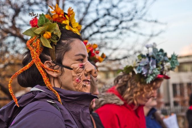 Shelia Dhand sings with the Philadelphia Women’s Slavic Ensemble at the Parade of Spirits gathering at Liberty Lands Park. (Kimberly Paynter/WHYY)