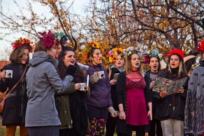 The Philadelphia Women’s Slavic Ensemble sings during the Parade of Spirits gathering at Liberty Lands Park. (Kimberly Paynter/WHYY)