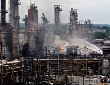 A fire burns at the Philadelphia Energy Solutions refinery hours after a series of early morning explosions on June 21, 2019. (Emma Lee/WHYY)