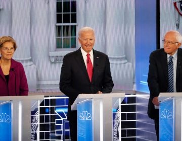 From left, Democratic presidential candidates Sen. Elizabeth Warren, D-Mass., former Vice President Joe Biden and Sen. Bernie Sanders, I-Vt., participate in a Democratic presidential primary debate, Wednesday, Nov. 20, 2019, in Atlanta. (AP Photo/John Bazemore)