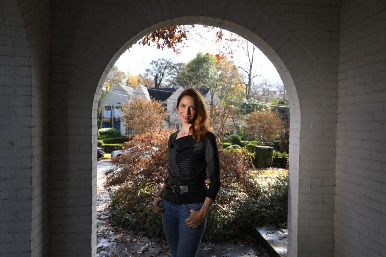 Georgia Tech professor Kim Cobb is shown at her home on Wednesday, Nov. 27, 2019 in Atlanta. Cobb is one of a number of scientists  deciding to do their part in cutting back on global warming by decreasing flying, composting leaves and waste, as well as using solar panels among other things. (John Amis/AP Photo)