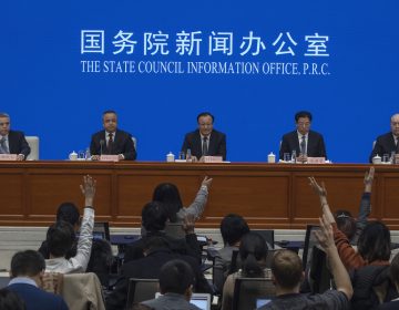 Shohrat Zakir, chairman of China's Xinjiang Uighur Autonomous Region, (center), waits for questions during a press conference in Beijing on Monday, Dec. 9, 2019. (Ng Han Guan/AP Photo)