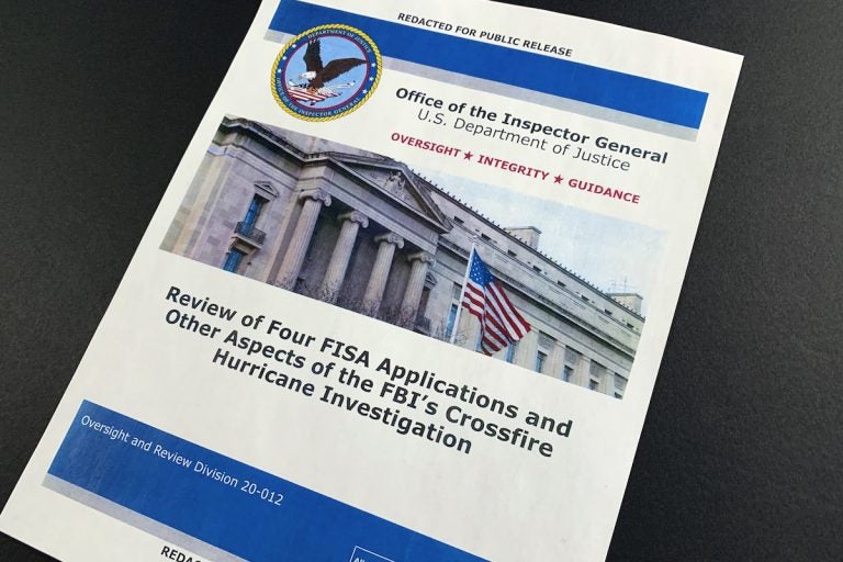 The cover page of the report issued by the Department of Justice inspector general is photographed in Washington, Monday, Dec. 9, 2019. The report on the origins of the Russia probe found no evidence of political bias, despite performance failures. (Jon Elswick/AP Photo)