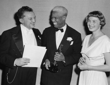 Jean Hersholt, from left, president of Academy of Motion Pictures Arts and Sciences, congratulates James Baskett, second African American to win an Oscar, for his special award for his portrayal of Uncle Remus in the 1946 Disney feature film 