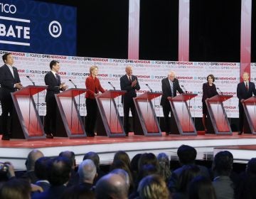 Democratic presidential candidates from left, entrepreneur Andrew Yang, South Bend Mayor Pete Buttigieg, Sen. Elizabeth Warren, D-Mass., former Vice President Joe Biden, Sen. Bernie Sanders, I-Vt., Sen. Amy Klobuchar, D-Minn., and businessman Tom Steyer participate in a Democratic presidential primary debate Thursday, Dec. 19, 2019, in Los Angeles. (Chris Carlson/AP Photo)