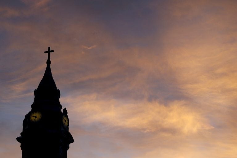 Clergy Abuse Pennsylvania Clouds are lit by the rising sun over St. Augustine Roman Catholic Church in Philadelphia.