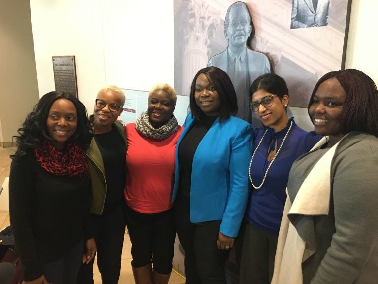 Former refugees joined advocates at the signing ceremony. From left, Sophie Marie Namugenyi, director of support services at Jewish Family Services; Saybah Wolokolie; Ajawavi J. Ajavon; Lourena Gboeah, refugee from Liberia; Padmaja Charya, refugee therapist with JFS; and Jenevive Newman, JFS refugee case manager. (Mark Eichmann/WHYY)