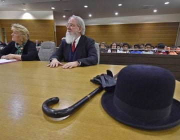 The Honorable M. Jane Brady sits next to Kent County, De. Family Court Judge James G. McGiffin, Jr., portraying Kris Kringle take part in a Christmas performance inside a courtroom at the New Castle County Courthouse in downtown Wilmington on Friday, Dec. 13, 2019.    (Butch Comegys for WHYY)