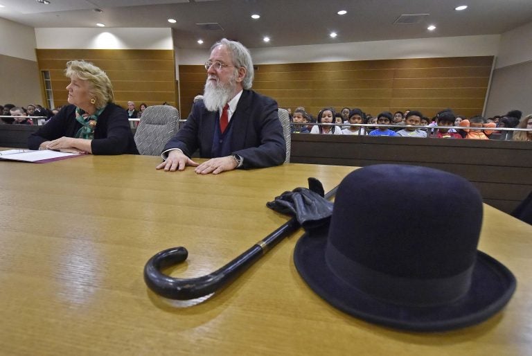 The Honorable M. Jane Brady sits next to Kent County, De. Family Court Judge James G. McGiffin, Jr., portraying Kris Kringle take part in a Christmas performance inside a courtroom at the New Castle County Courthouse in downtown Wilmington on Friday, Dec. 13, 2019.    (Butch Comegys for WHYY)