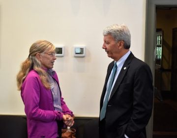 Starr Cummin Bright, a gunshot survivor, speaks with state Sen. Tom Killion, R-Delaware/Chester, ahead of a panel discussion on Oct. 1, 2019, at the Chadds Ford Township Municipal Building. (Ed Mahon/PA Post)