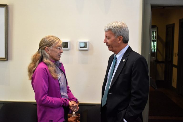 Starr Cummin Bright, a gunshot survivor, speaks with state Sen. Tom Killion, R-Delaware/Chester, ahead of a panel discussion on Oct. 1, 2019, at the Chadds Ford Township Municipal Building. (Ed Mahon/PA Post)