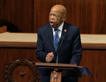 Rep. John Lewis, D-Ga., speaks as the House of Representatives debates the articles of impeachment against President Trump this month. Lewis says he’ll stay in office while he undergoes treatment for pancreatic cancer. Rep. John Lewis, D-Ga., speaks as the House of Representatives debates the articles of impeachment against President Trump this month. Lewis says he'll stay in office while he undergoes treatment for pancreatic cancer.
(House Television via AP)