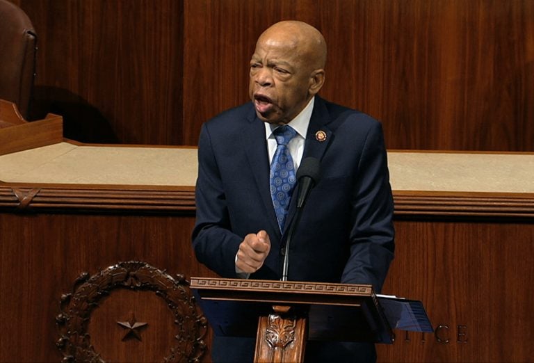 Rep. John Lewis, D-Ga., speaks as the House of Representatives debates the articles of impeachment against President Trump this month. Lewis says he'll stay in office while he undergoes treatment for pancreatic cancer.
(House Television via AP)