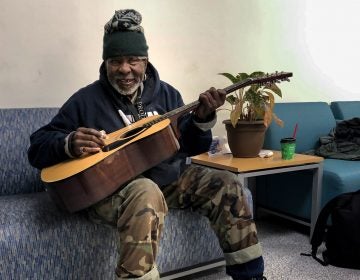John Oliver, Jr., plays guitar at Hub of Hope's Living Room (Michaela WInberg/Billy Penn)