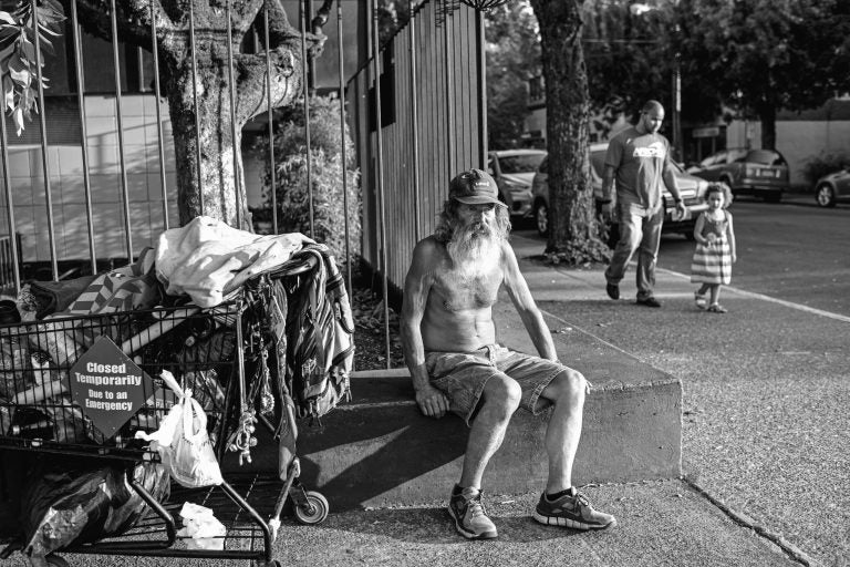 Mike Stepp, one of Nick's former neighbours  who has been homeless for around a decade, prepares to sleep in his regular spot in downtown McMinnville, Oregon, August 7, 2018. (Credit: Lynsey Addario)