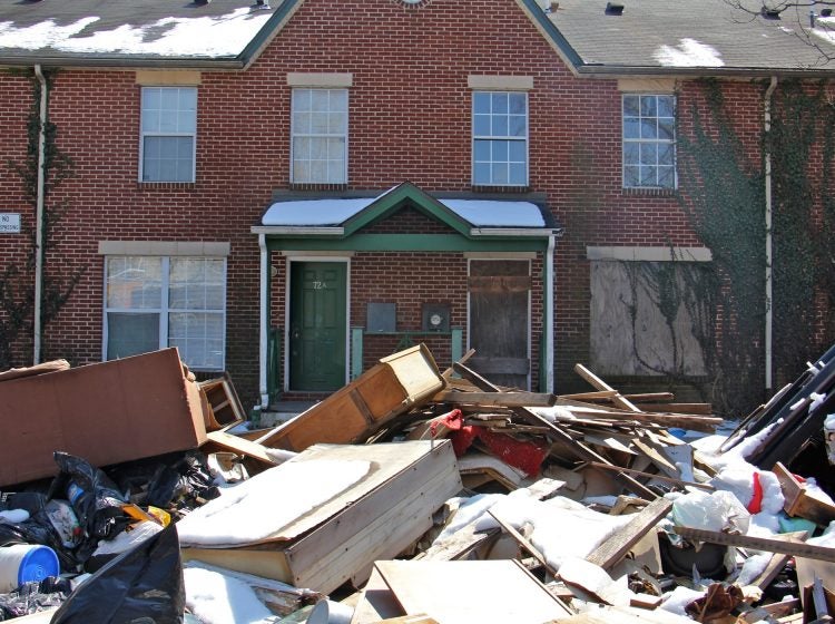 A 2018 file photo shows garbage piled in front of an apartment complex in Lower Germantown.