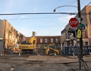 Several rowhouses were destroyed by an explosion and fire that killed two people on the 1400 block of S. 8th Street. (Emma Lee/WHYY)