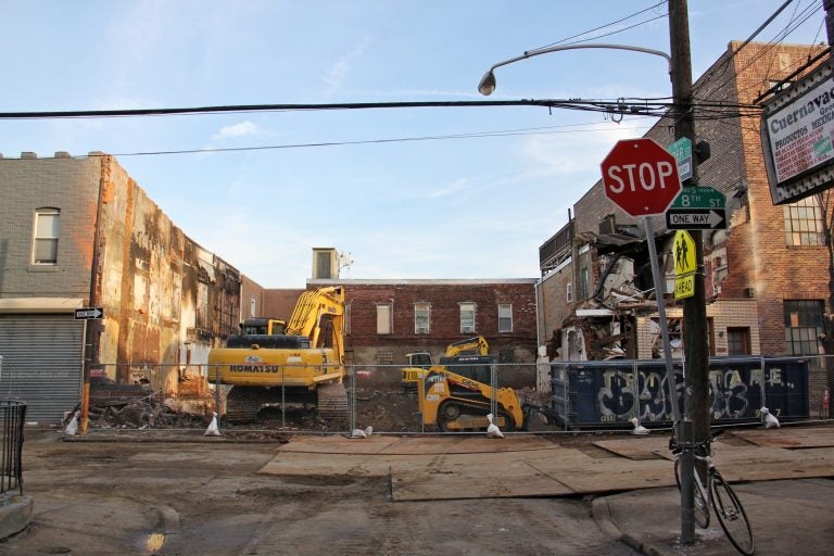 Several rowhouses were destroyed by an explosion and fire that killed two people on the 1400 block of S. 8th Street. (Emma Lee/WHYY)