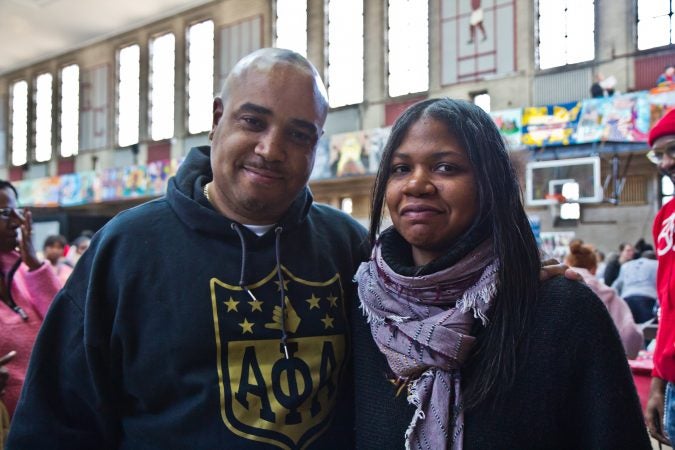 Eric Toatley with the Alpha Phi Alpha fraternity and Leslie Grace, executive director of Elements of Community, organized the Youth Financial Reality Fair for the MLK Day of Service at Philadelphia’s Girard College. (Kimberly Paynter/WHYY)