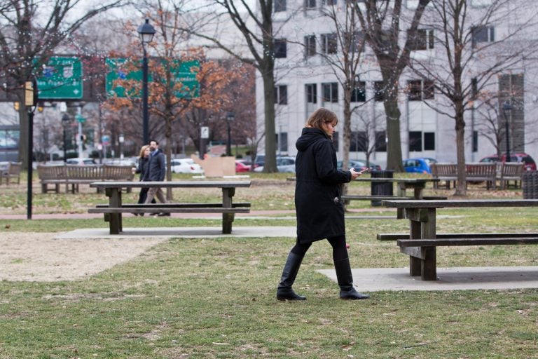 People enjoy Franklin Square Park on a gray January day. (Kimberly Paynter/WHYY)