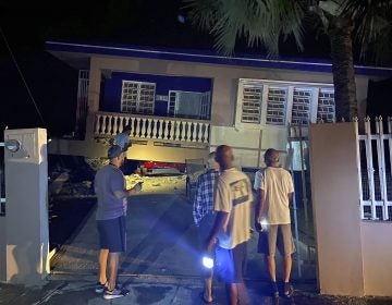 A collapsed building with car crushed underneath, following an earthquake in Yauco, Puerto Rico, Tuesday Jan. 7, 2020.  All the occupants of the home are reported to be uninjured.  A 6.5-magnitude earthquake struck Puerto Rico, the largest in a series of quakes in recent days, and caused heavy damage in some areas.  (J. Miguel Santiago Twitter via AP)