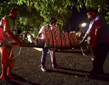 Volunteers move food for many refugees from Guanica that choose to remain outdoors for fear of possible aftershocks on their first night after a  6.4-magnitude earthquake struck Puerto Rico, killing one man, injuring at least eight other people and collapsing buildings, in Guanica, Puerto Rico, Tuesday, Jan. 7, 2020. (Carlos Giusti/AP Photo)