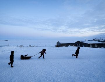 Children play in the snow Saturday, Jan. 18, 2020, in Toksook Bay, Alaska. The first Americans to be counted in the 2020 Census starting Tuesday, Jan. 21, live in this Bering Sea coastal village. (Gregory Bull/AP Photo)