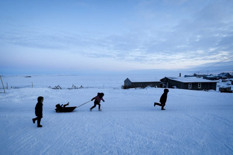 Children play in the snow Saturday, Jan. 18, 2020, in Toksook Bay, Alaska. The first Americans to be counted in the 2020 Census starting Tuesday, Jan. 21, live in this Bering Sea coastal village. (Gregory Bull/AP Photo)