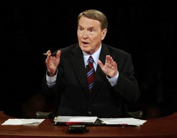 FILE - This Sept. 26, 2008 file photo shows debate moderator Jim Lehrer during the first U.S. Presidential Debate between presidential nominees Sen. John McCain, R-Ariz., and Sen. Barack Obama, D-Ill., at the University of Mississippi in Oxford, Miss.  PBS announced that PBS NewsHour's Jim Lehrer died Thursday, Jan. 23, 2020, at home. He was 85. (AP Photo/Chip Somodevilla, File)