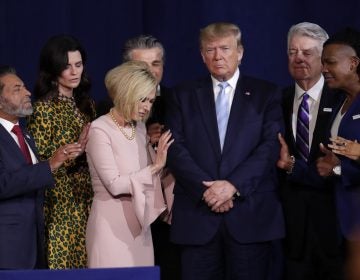 FILE - In this Jan. 3, 2020, file photo, faith leaders pray with President Donald Trump during a rally for evangelical supporters at the King Jesus International Ministry church in Miami. As he heads into the 2020 election, Donald Trump will become the first sitting president to address the March for Life when he takes the stage Friday at the annual anti-abortion gathering. The move is Trump's latest nod to the white Evangelical, conservative Christian voters who have proven to be among his most loyal backers. (AP Photo/Lynne Sladky, File)