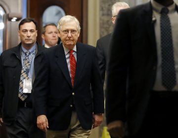 Senate Majority Leader Mitch McConnell of Ky., center, arrives at the Capitol in Washington during the impeachment trial of President Donald Trump on charges of abuse of power and obstruction of Congress, Saturday, Jan. 25, 2020. (Julio Cortez/AP Photo)